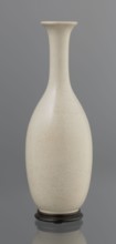 Vase on saucer. Stoneware or thick porcelain?, ovoid with a long cylindrical neck flaring at the