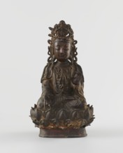 Guanyin, unknown creator; sculptor unknown. Chinese Buddhist bodhisattva figurine on a lotus throne
