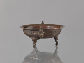 Ding vessel, Tripod bronze vessel with three legs and two handles; used for ritual hand washing.