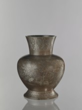 Vase, pewter alloy ovoid bulbous vase on a wide base with a wide flared neck. Engraved decoration