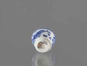 Bowl; Chinese; 19th century. Blue-and-white porcelain vessel decorated with dragons, phoenixes