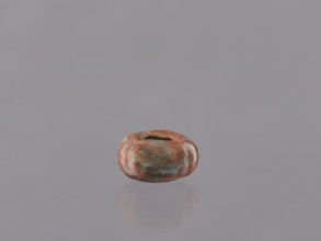 Cosmetic vessel, hand-made vessel. Vessel head made of yellowish clay, hand-formed. Reddish glaze