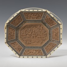 Basket. Octagonal, shallow wooden basket with an ivory rim and handle. Inside the basket is a