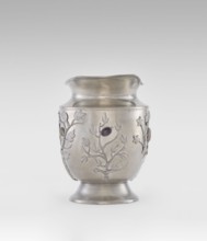 Jug, ornamented with plant motifs and fruit, featuring applied plastic decoration of flowering