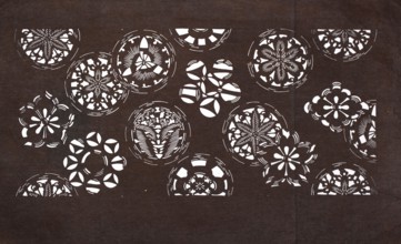 Katagami dyeing stencil with a motif of stylized floral rosettes and cherry blossoms kawari kamon