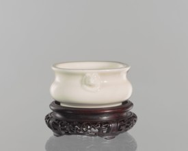 Table stand, shallow recessed base on four feet; geometric and plant ornament; Chinese; Qing