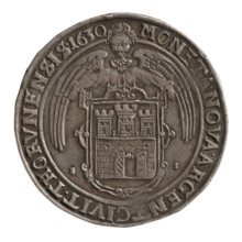Half-length portrait of the king to the right, wearing a crown and armor, holding an orb and a