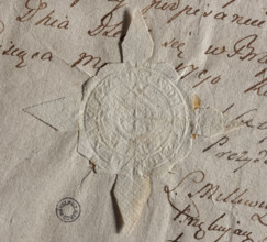 Round seal impression of the city of Brzesc Kujawski. In the rim an equal-armed cross. The rim