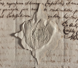 Round seal impression of the town of Chojnice. Ox head with curled horns. Between the horns and on