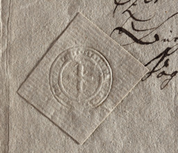 Round seal impression of the town of Góra Kalwaria. A cross on the hill. Illegible inscription on