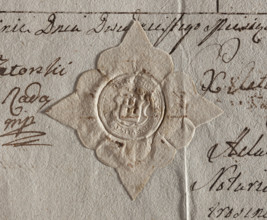 Round seal impression of the town of Jutroszyn, Kalisz Voivodeship. On the shield there is a wall