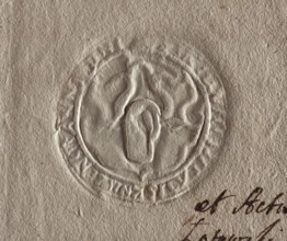 Round seal impression of the town of Knyszyn, Podlaskie Voivodeship. On the shield an outline of an