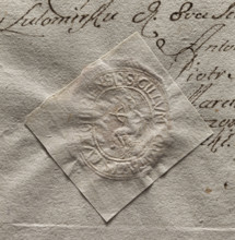 Oval seal impression of the town of Lutomiersk. In the central part—a seated figure holding a