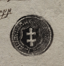 Round ink impression of the city seal of Miechów. In a baroque cartouche a double cross. Rim