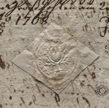 Round seal impression of the city of Miedzychód. Among the branches of a tree with marked roots — a
