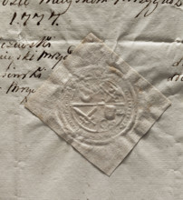 Round seal impression of the town of Mrzyglód. Central quadripartite field with an illegible