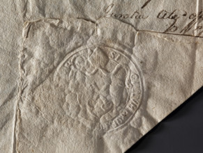 Round seal impression of the town of Mstów. Under the bishop's mitre, a baroque cartouche with two