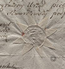Round seal impression of the town of Odolanów. In an oval decorative cartouche an illegible drawing