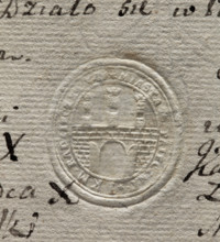 Oval seal impression of the town of Pajeczno. City wall with an open gate and three towers topped