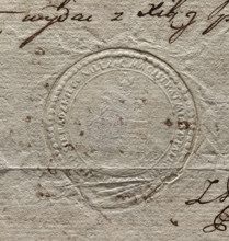 Round seal impression of the town of Pajeczno. City wall with three towers and an open gate. An