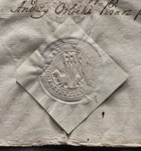 Round imprint of the city seal of Pogorzela. Tower with a gate and three battlements; behind it a