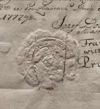 Round seal impression of the town of Proszowice, Kraków Voivodeship. In a round, baroque cartouche