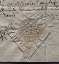 Round imprint of the Rudnik town seal. Illegible coat of arms on the shield. Above the crowned