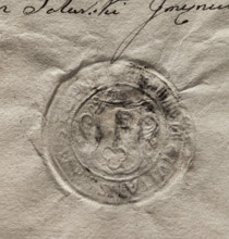 Round seal impression of the town of Stopnica. In a decorative cartouche, a key with its teeth up.