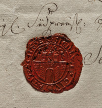 Oval wax impression of the seal of Szadek. Town wall with an open gate, on it three towers with
