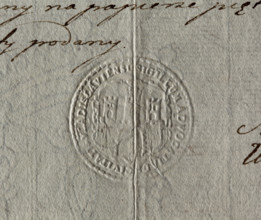 Round impression of the city seal of Wloclawek. City wall with an open gate, battlements and three