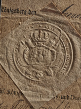 dry impression of an oval royal seal depicting an eagle with spread wings, royal camera seal, royal