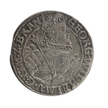 Obv. Bust facing right in a mitre, wide ruff, and armor girded with a sash. In his right hand a