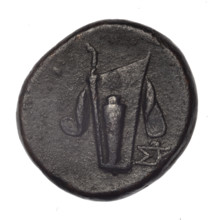 bronze coin from Pantikapaion; obverse: head of young Dionysus in an ivy wreath facing right;