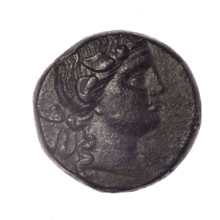 Bronze coin, Pantikapaion. Obverse: head of young Dionysus in an ivy wreath facing right. Reverse: