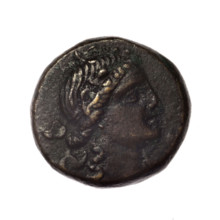 Bronze coin, Pantikapaion; obverse: head of young Dionysus in ivy wreath facing right; reverse: bow