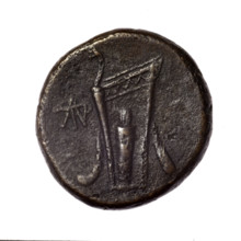 Bronze coin from Pantikapaion; obverse: head of young Dionysus in ivy wreath facing right; reverse: