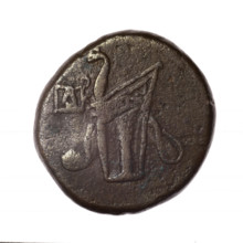 bronze coin, Pantikapaion; obv.: head of young Dionysus in an ivy wreath facing right; reverse: bow