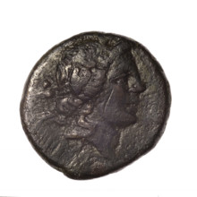 bronze coin from Pantikapaion; obverse: head of young Dionysus in an ivy wreath facing right;
