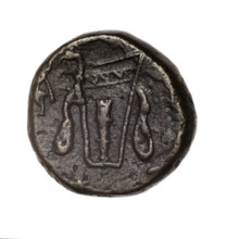 bronze coin, Pantikapaion; obv.: head of young Dionysus in an ivy wreath facing right; rv.: bow and