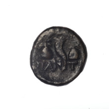 bronze coin, Pantikapaion; head of a bearded Satyr in an ivy wreath facing left (obverse);