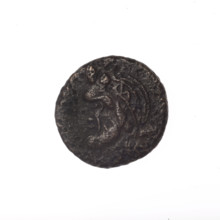 bronze coin, Pantikapaion; head of a bearded Satyr in an ivy wreath facing left (obverse);