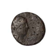 Bronze coin from Pantikapaion, obverse: head of Apollo in a laurel wreath facing right; behind it a