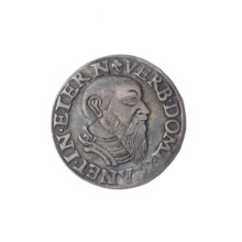 Male bust in armour turned right, with a beard and sideburns; rim with pearl border and inscription