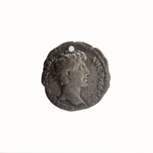Denarius (with a hole). Obverse: Head of Antoninus Pius in a laurel wreath facing right,