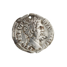 Denarius (with a hole). Obverse: Head of Septimius Severus in a laurel wreath facing right,
