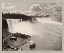 Niagara Falls, United States, Canada, photograph, a boat is sailing in the middle at the bottom.,