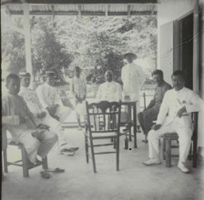 Manoekwari, Seven men and a child on a veranda in Manokwari, West Papua, stereograph, Manokwari,