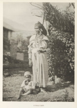 Woman with a child at Kullu, Himachal Pradesh, India, page, photomechanical print, caption: 'A KULU