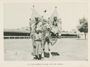 In the Arabian village, on the Midway, Three men with a camel at the World's Columbian Exposition