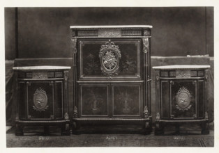 Secretary and two triangular corner pieces of furniture decorated with medallions and plant motifs,